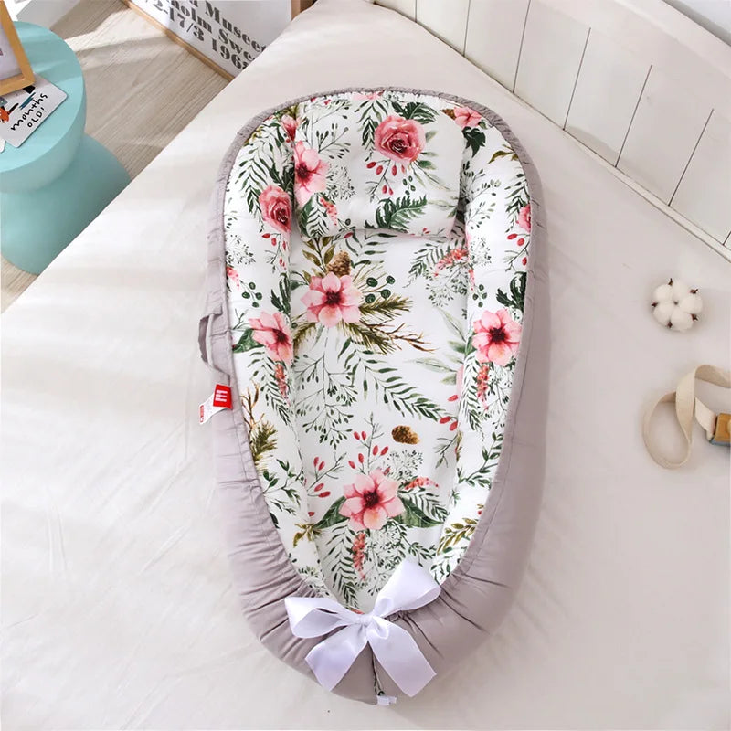 Floral-themed baby nest with cozy and breathable cotton fabric.