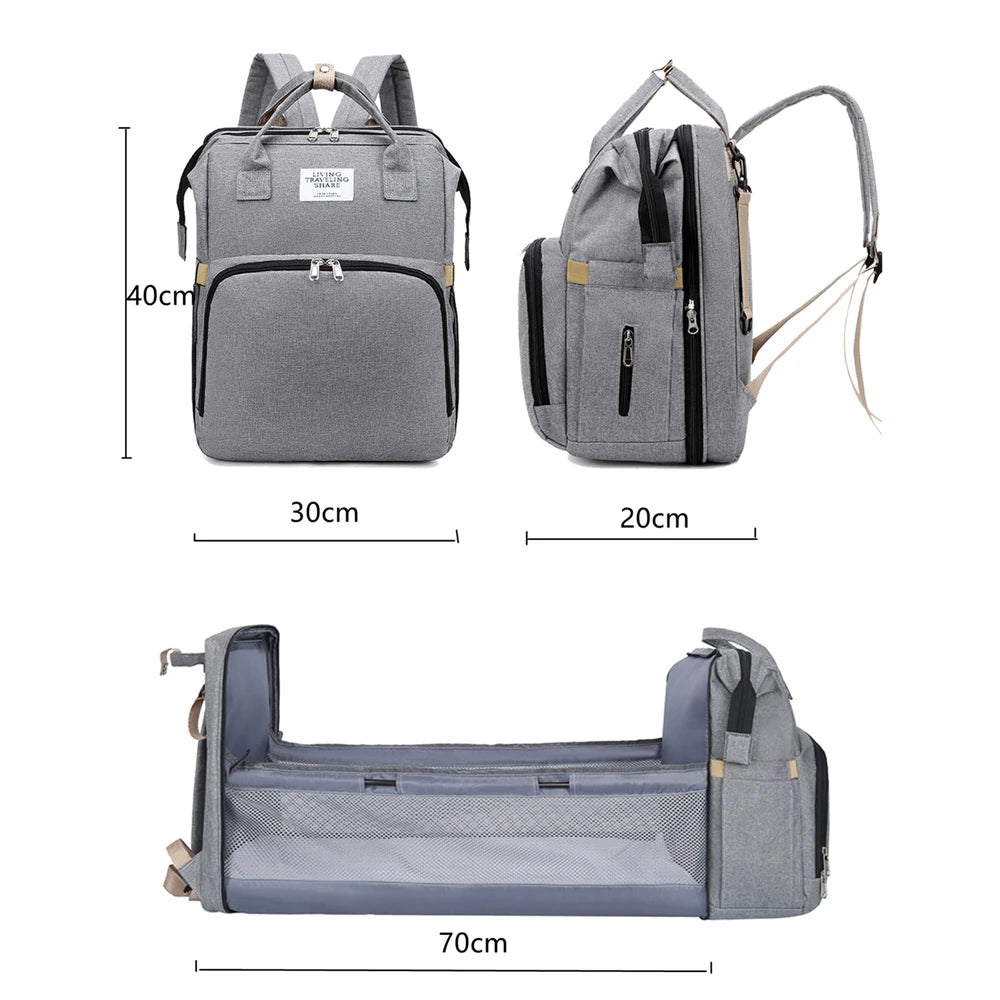 Multifunctional diaper bag with built-in bassinet in Gray – spacious and stylish.